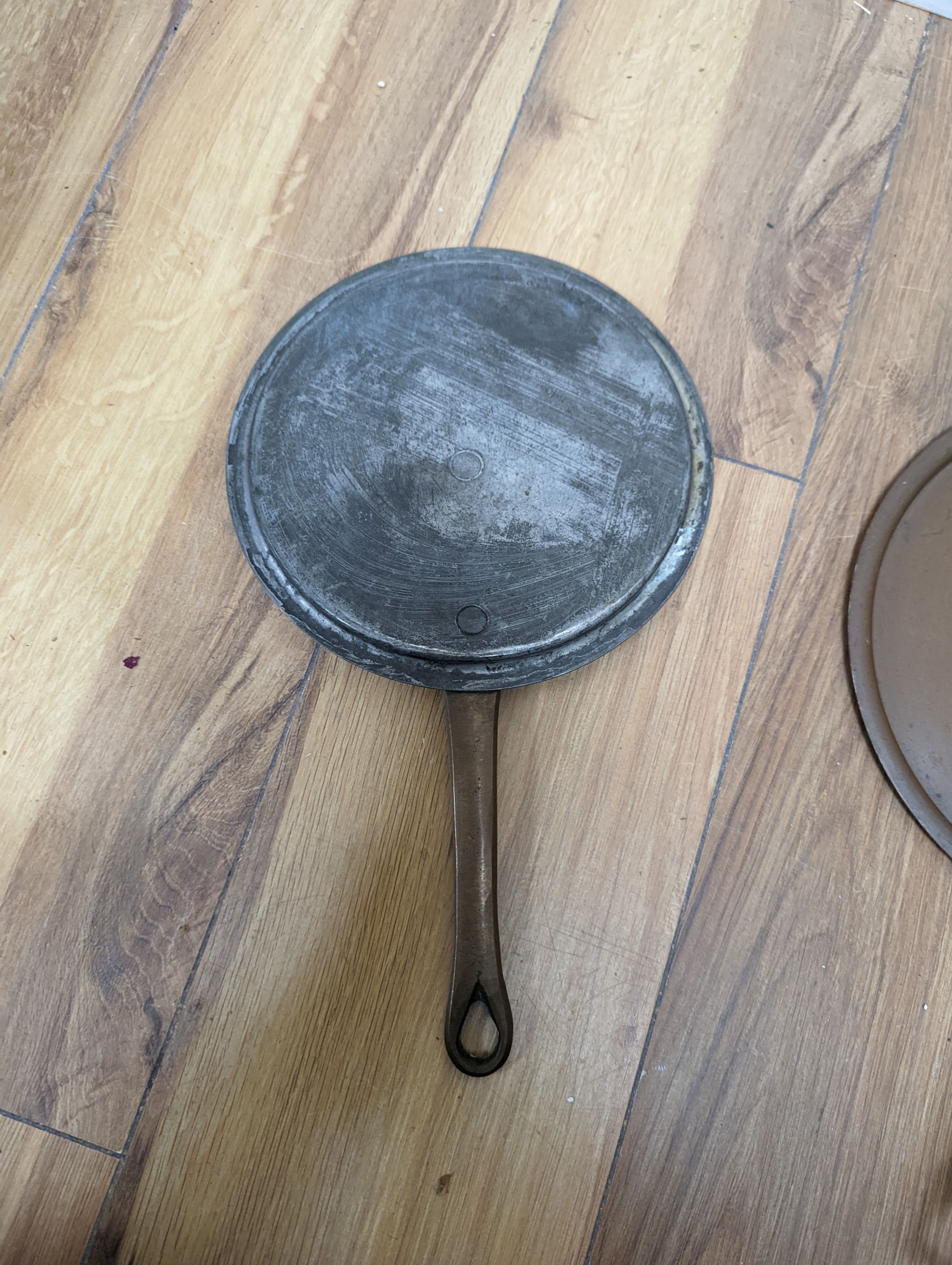 A group of three Jaeggi & Sons copper saucepans